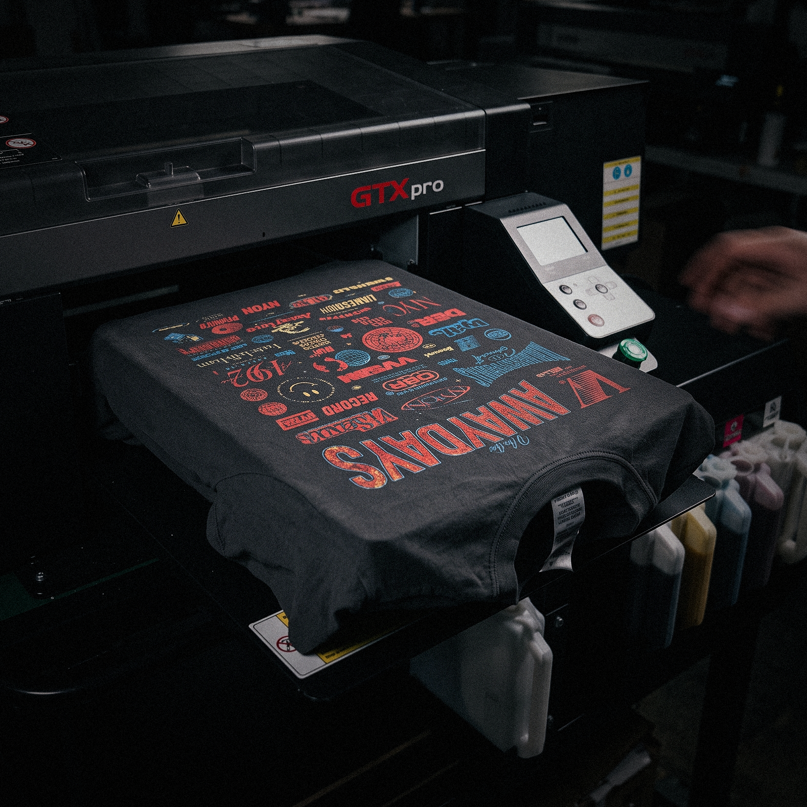 A DTG press mid-run on a short cotton run